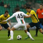 Spelsituatie op Den Dreef tijdens OH Leuven tegen Union SG, met focus op een betwiste handsfase