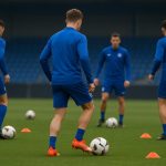 Training bij KRC Genk met spelers op de achtergrond, zonder herkenbare gezichten