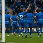 Spelers van KRC Genk vieren een doelpunt tegen Malmö in het stadion.