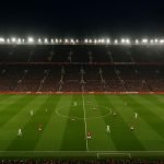 Luchtzicht op een Engels voetbalstadion tijdens een avondwedstrijd