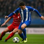 Actiefoto van Hyllarion Goore in actie voor KAA Gent tijdens een wedstrijd