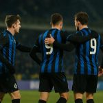 Spelers van Club Brugge vieren op het veld na de zege tegen Kairat Almaty in Astana