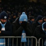 Meegereisde Manchester City-supporters in een koud stadion in Noorwegen tijdens een Europese uitmatch