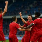 Spelers van Standard vieren de 0-3-zege op bezoek bij KRC Genk