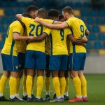 Spelers van SK Beveren vieren samen na een wedstrijd in Eerste Klasse B