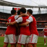 Arsenal-spelers vieren een doelpunt in de FA Cup tegen Wigan Athletic in het Emirates Stadium.