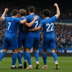 Spelers van KRC Genk vieren een overwinning op het veld