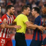 Spelers van Girona en Barcelona in een duel tijdens het competitieduel, met Axel Witsel in beeld.