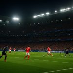 Avondbeeld in een stadion tijdens Benfica tegen Real Madrid, met spelers in de achtergrond zonder herkenbare gezichten