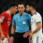 Spelers van Benfica en Real Madrid in discussie tijdens een Champions League-wedstrijd