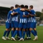 Spelers van KAA Gent vieren op het veld na de zege bij Dender in Denderleeuw.