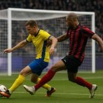 De bal rolt richting doel tijdens een wedstrijd in de Jupiler Pro League, in de context van de topschuttersstrijd.