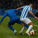 Speler van KRC Genk in een verdedigend duel tijdens een wedstrijd