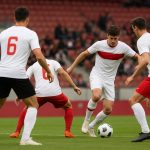 Rode Duivels in Magritte-truitjes tijdens de match tegen de Verenigde Staten