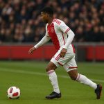 Mika Godts in actie met Ajax tijdens een wedstrijd