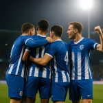 Spelers van KRC Genk vieren na de 3-0 zege tegen KAA Gent.