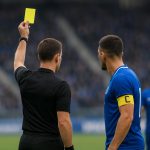 Bryan Heynen van KRC Genk reageert teleurgesteld na een gele kaart