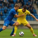 Actiebeeld uit de Limburgse derby tussen KRC Genk en STVV met een duel op het middenveld.