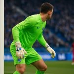 Lucca Brughmans van KRC Genk in keepersactie tijdens een wedstrijd op de Bosuil.