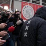 Tense Ajax press atmosphere near the stadium linked to club unrest and calls for change.