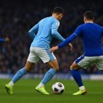 Jérémy Doku viert na zijn late gelijkmaker voor Manchester City tegen Everton.