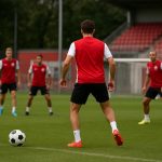 Spelers van FC Utrecht op training, met focus op een verdediger op de achtergrond