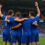 Spelers van KRC Genk vieren samen na een wedstrijd in het stadion