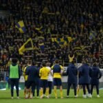 Spelers van Union vieren op het veld in een stadionsetting, met de focus op sfeer en teammoment.
