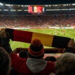 Sfeerbeeld rond de Rode Duivels in een vol stadion voor een WK-wedstrijd