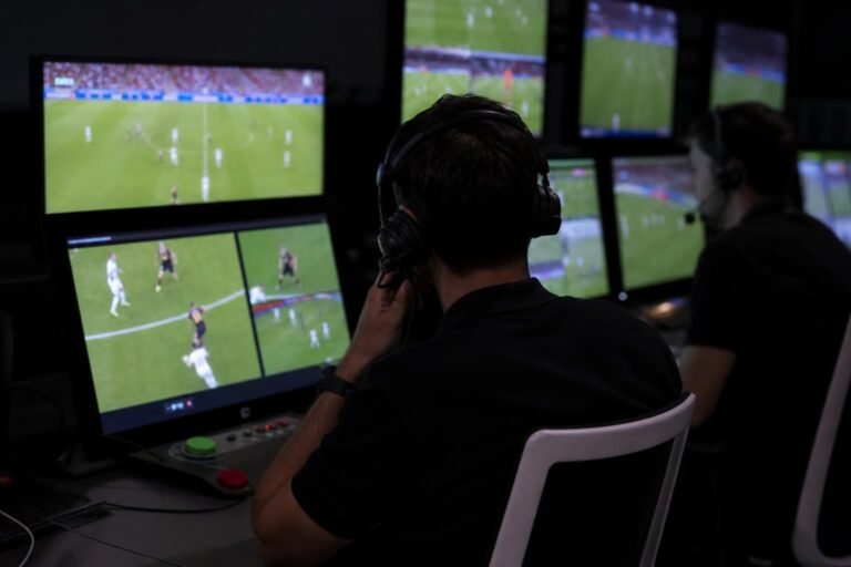 Tense VAR-room atmosphere during a World Cup match without identifiable faces