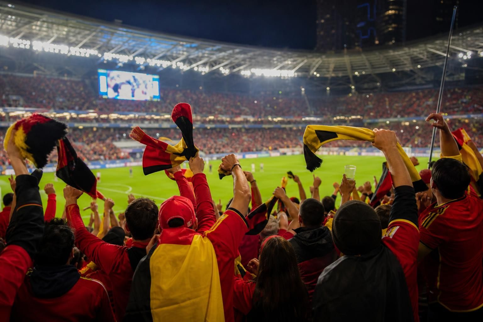 Belgische supporters vieren in een WK-stadion tijdens een wedstrijd van de Rode Duivels
