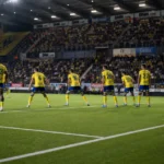 Spelers van STVV vormen een defensief blok tijdens een wedstrijd in hun stadion