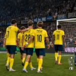Niet-identificeerbare Union-spelers op het veld na afloop, met de tribunes van Club Brugge op de achtergrond.