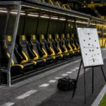 De technische zone van Borussia Dortmund in een rustig stadion vlak voor een wedstrijd.