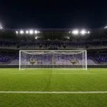 Leeg doelgebied in een verlicht stadion met een discreet RSC Anderlecht-bord langs het veld.