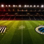 Stadioncompositie met Sporting Charleroi centraal als leider en Club Brugge als onttroonde koploper