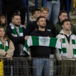 Een groep ingetogen Lommel SK-supporters in het uitvak na de wedstrijd.