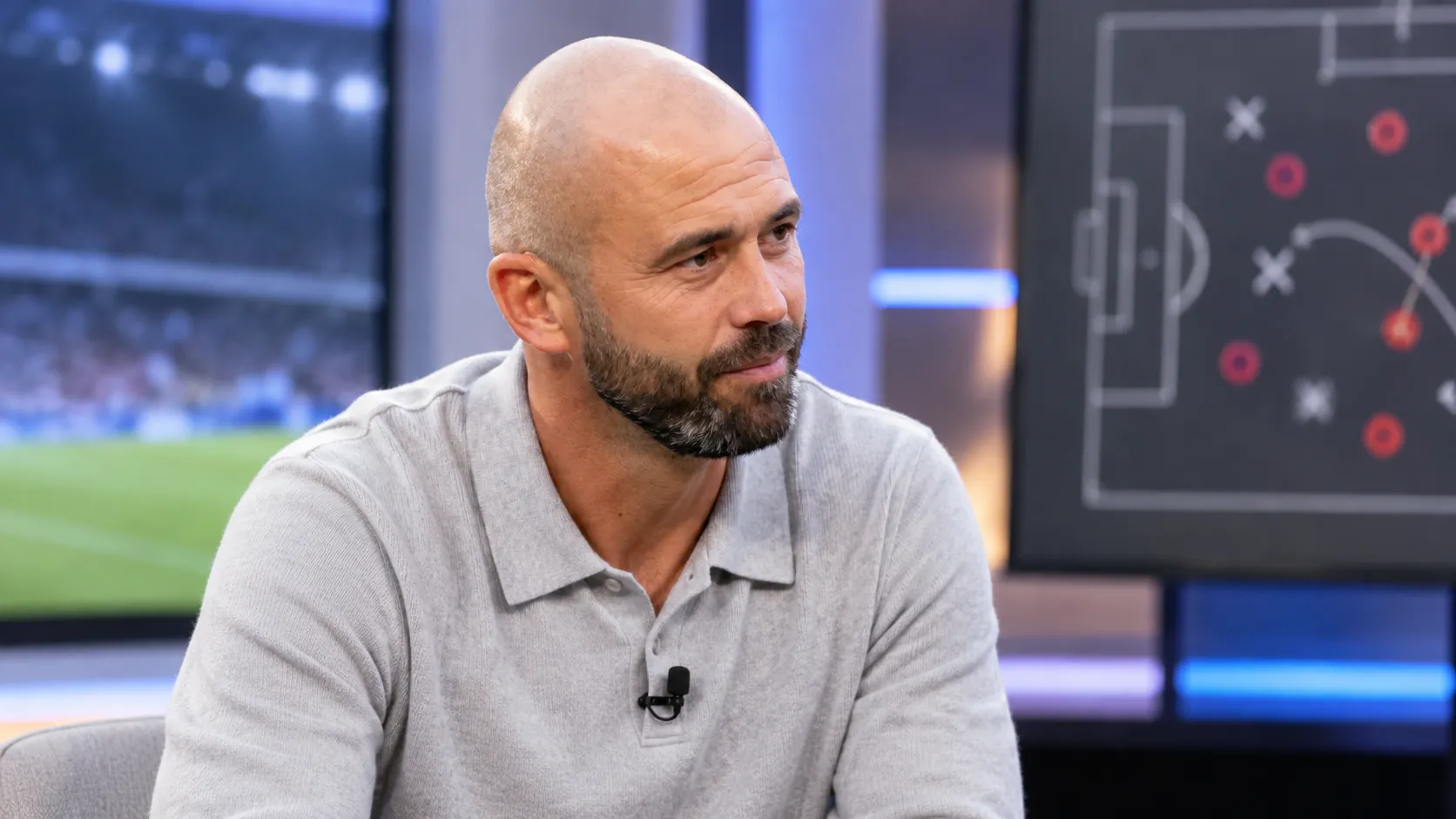 Steven Defour in een neutrale televisiestudio tijdens een voetbalgesprek.