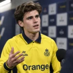 Besfort Zeneli van Union spreekt na een wedstrijd in de mixed zone van een stadion.