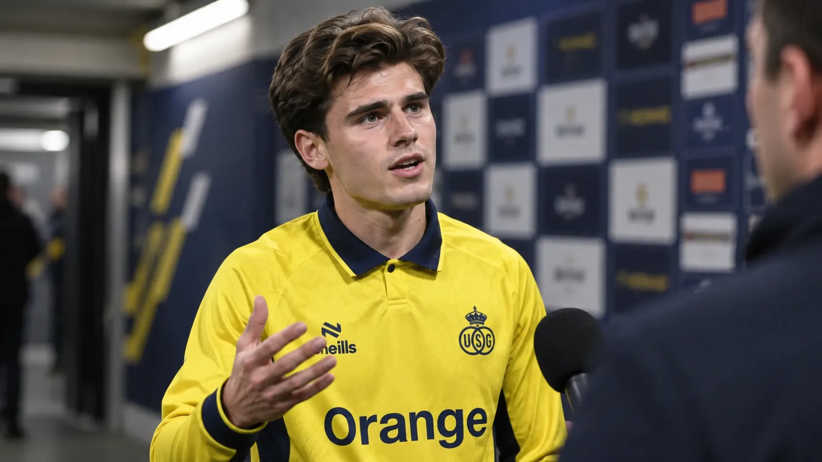 Besfort Zeneli van Union spreekt na een wedstrijd in de mixed zone van een stadion.