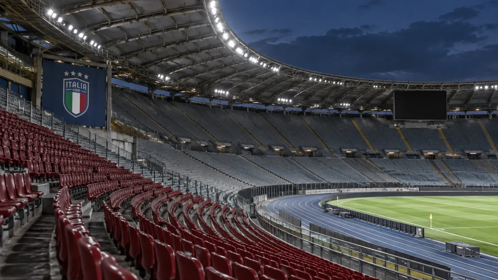 Lege zitjes in het Stadio Olimpico met een vast Italië-embleem aan de stadionwand.