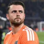 Colin Coosemans in een oranje doelmanstenue na een wedstrijd.