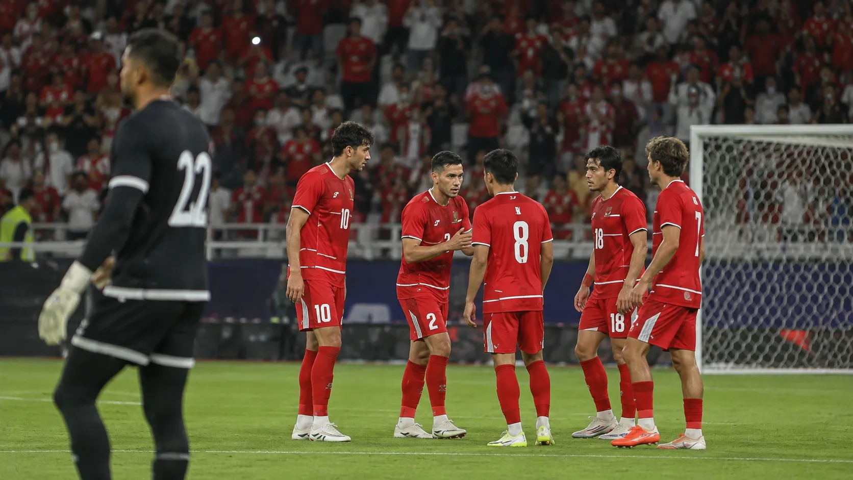 Indonesische spelers in rode tenues tijdens de finale tegen Thailand.