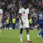 Belgische en Franse spelers op het veld na het laatste fluitsignaal.