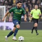 Adem Zorgane van Union Saint-Gilloise in actie tijdens een wedstrijd.